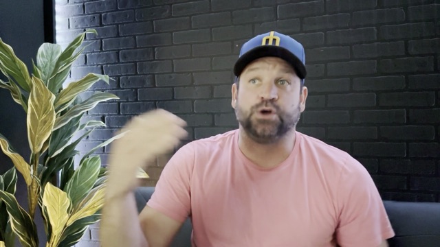 Video still of Brandon gesturing mid-sentence